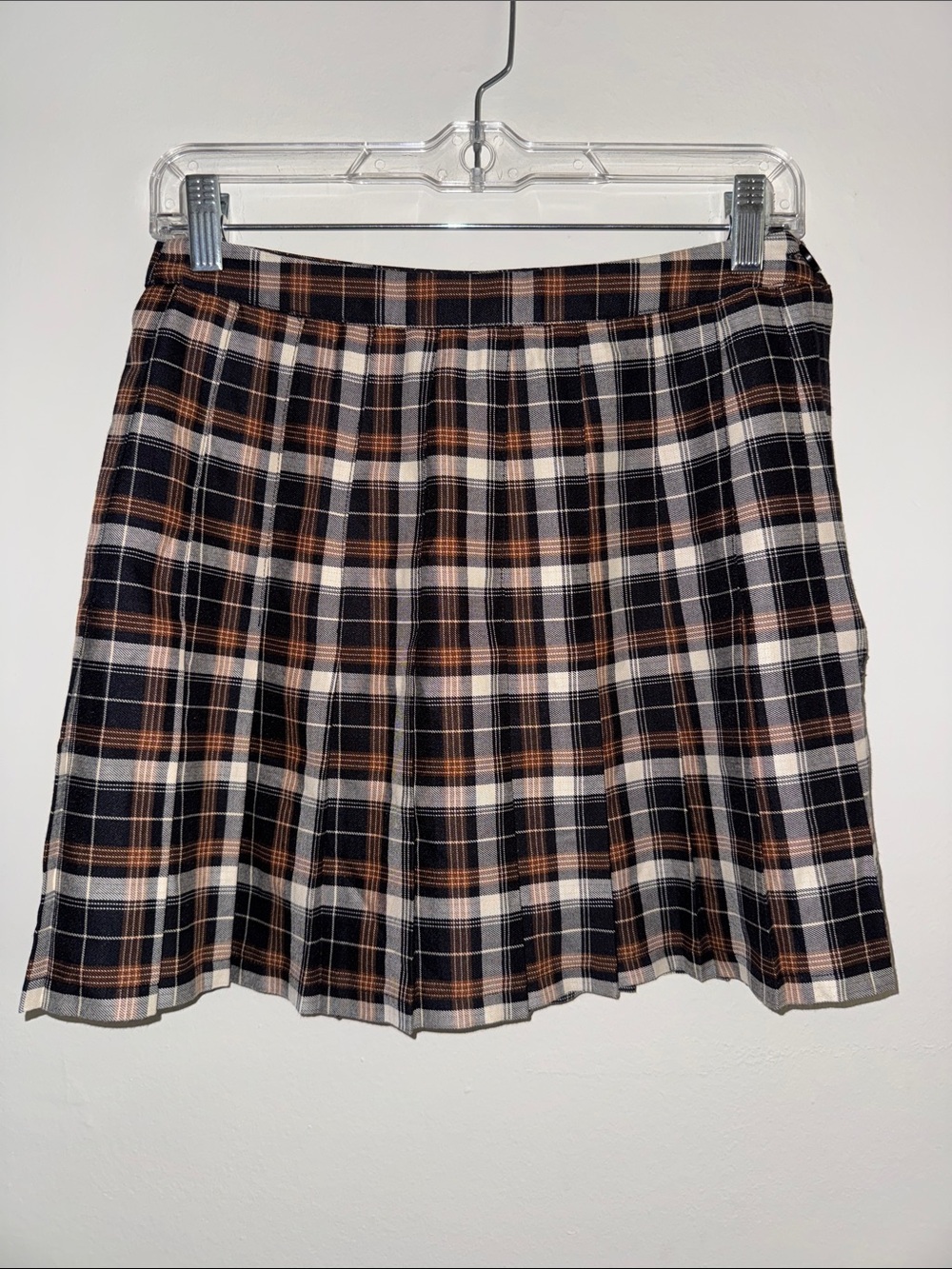 Urban Outfitters Plaid Pleated Mini Skirt in Black, Brown, and Cream